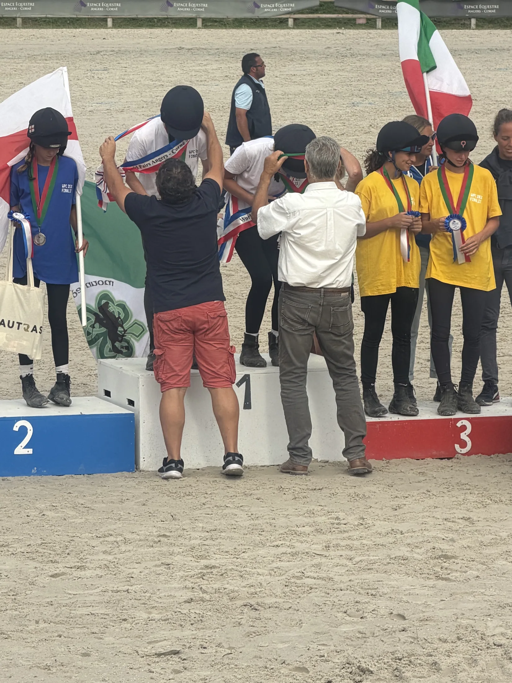 Medals presented on the podium at the World Pairs Championship, Angers.