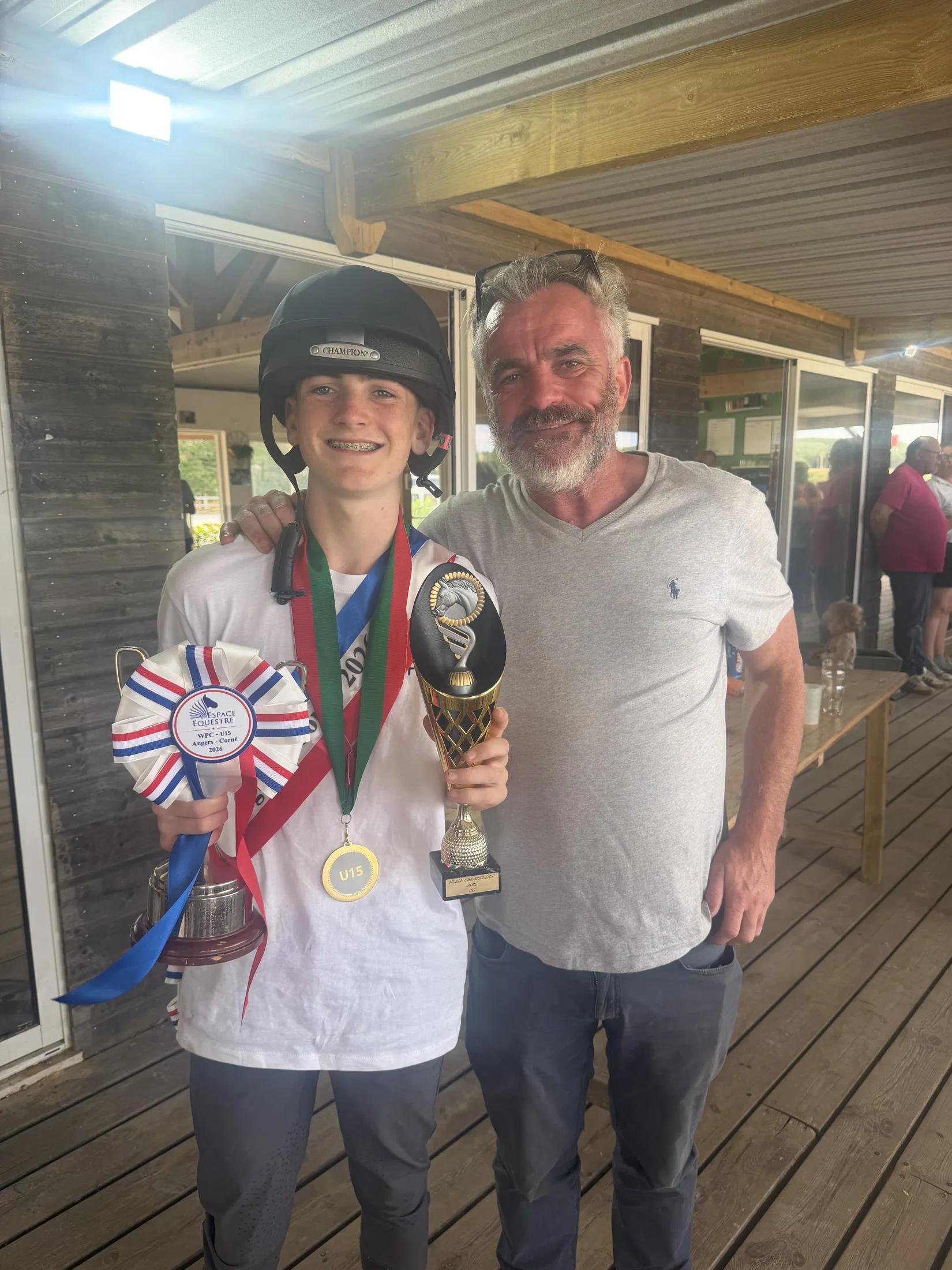 Mikey with the World Championship trophy and his dad at Angers.